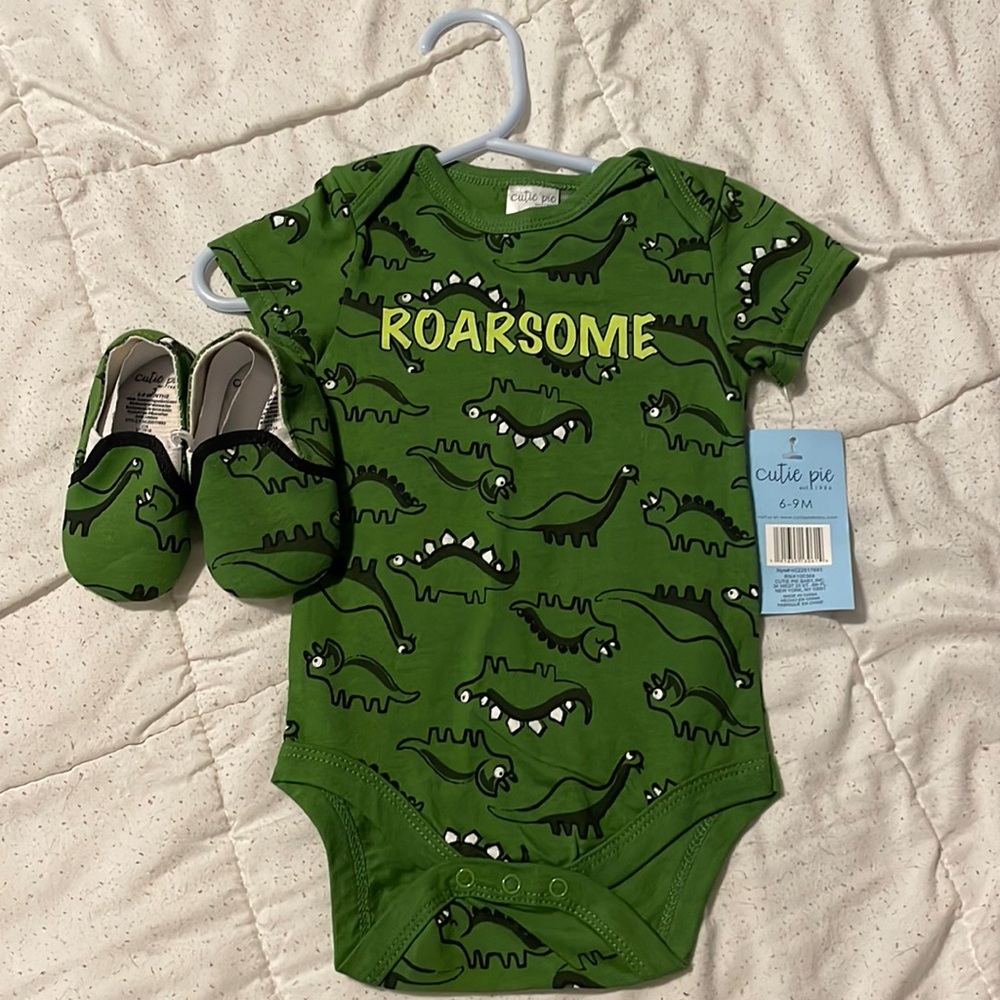 New with tags Dino onesie with matching shoes. Size 6-9 months